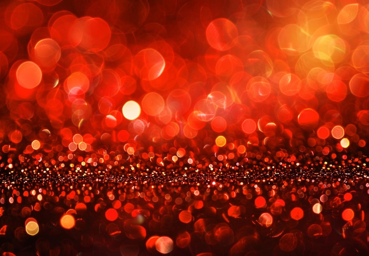 PSD a colorful background with a red and orange glitter and a red background