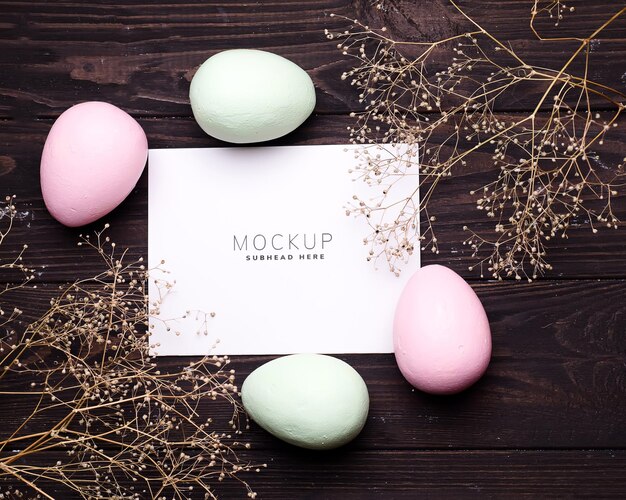 Colorful Easter eggs and flowers on paper mockup