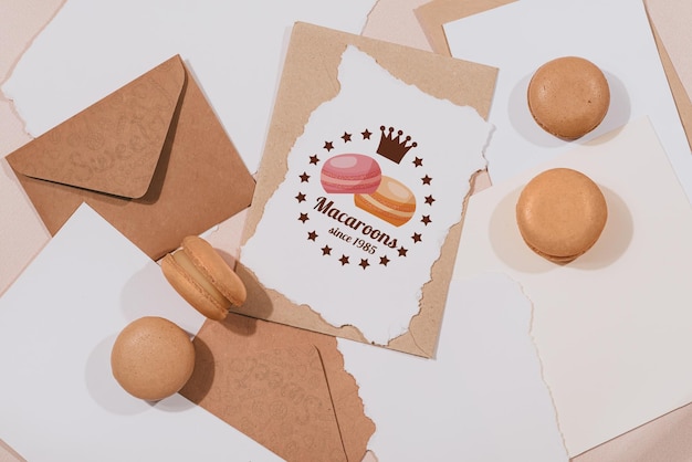 Colorful macarons and mockup letter on white textile