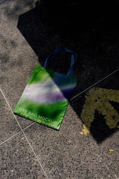 PSD colorful tote bag mock-up outdoors on golden hour