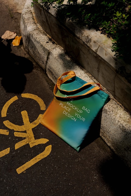 PSD colorful tote bag mock-up outdoors on golden hour