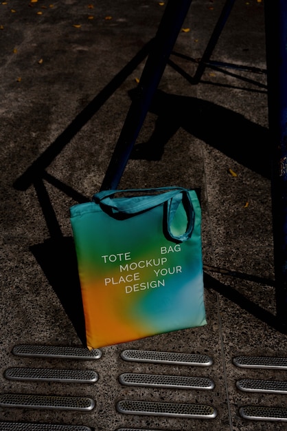 PSD colorful tote bag mock-up outdoors on golden hour