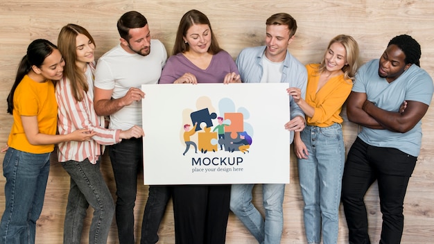 PSD community mockup with group of people holding banner mockup