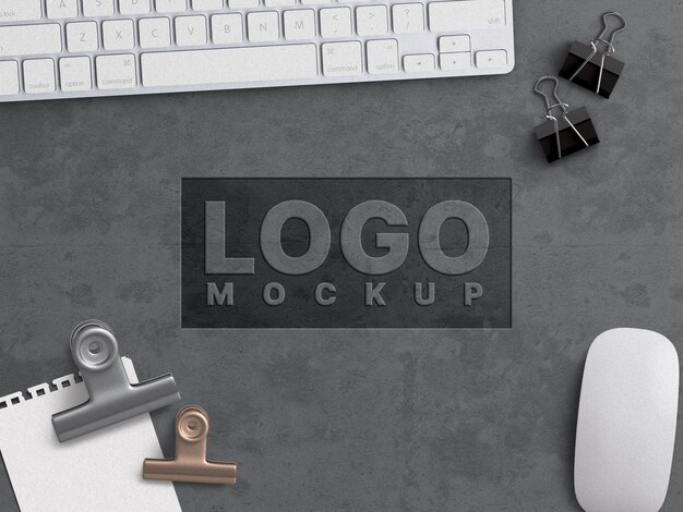 company business logo mockup work concept carved on grunge concrete surface with office appliances