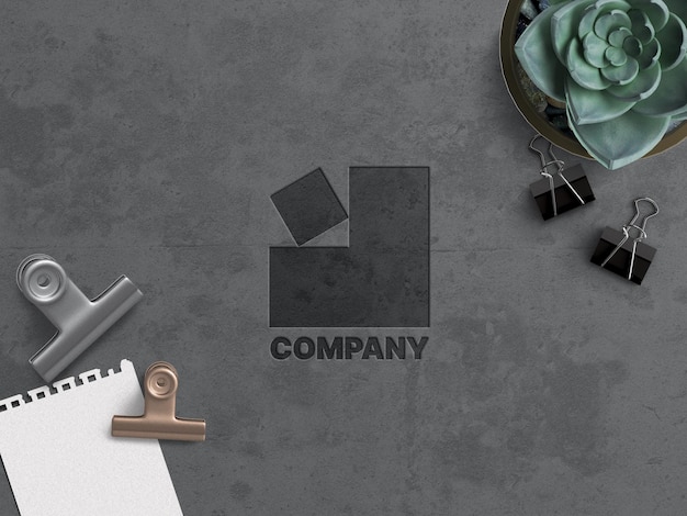 Концепция работы макета бизнес-логотипа компании, вырезанная на бетонной поверхности в стиле гранж с офисной техникой