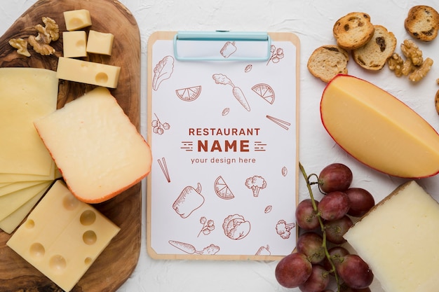 Composition of delicious foods with clipboard mock-up