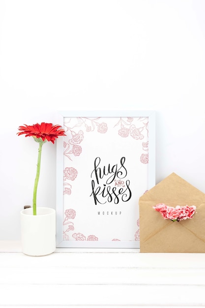 PSD composition of gerbera flowers next to frame mockup