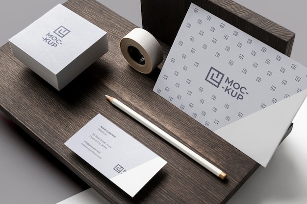 PSD composition of mock-up stationery on wood