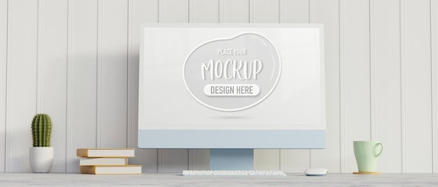 computer device with mockup screen on the desk with books cactus pot and mug  