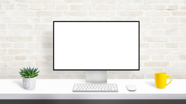 Computer display with isolated, blank, white screen for web site presentation mockup. concept of designer studio