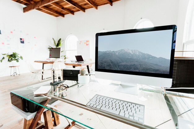 PSD computer on a glass table mockup