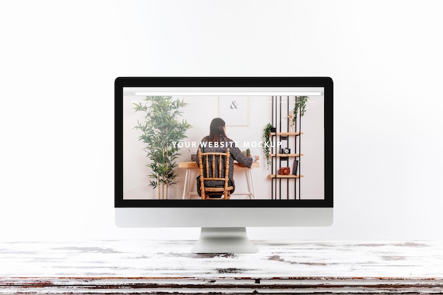 computer mockup on wooden desk