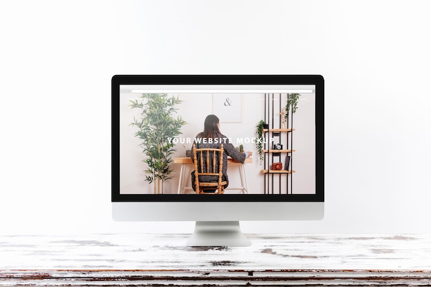 PSD computer mockup on wooden desk