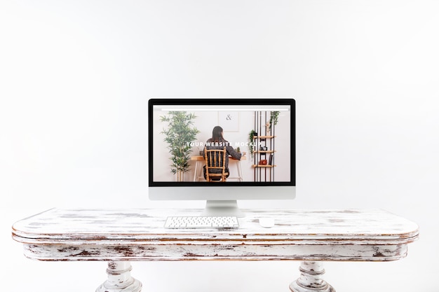 PSD computer mockup on wooden desk