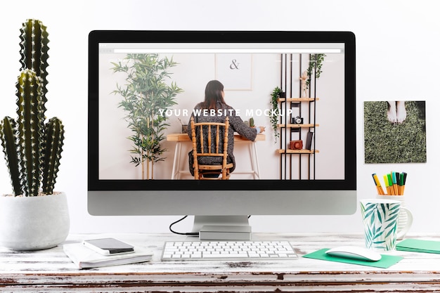 PSD computer mockup on wooden desk