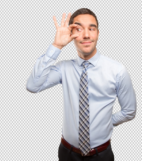 Concentrated young man doing an observation gesture