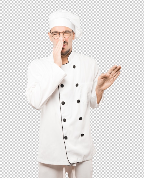 PSD concerned young chef with a gesture of disgust