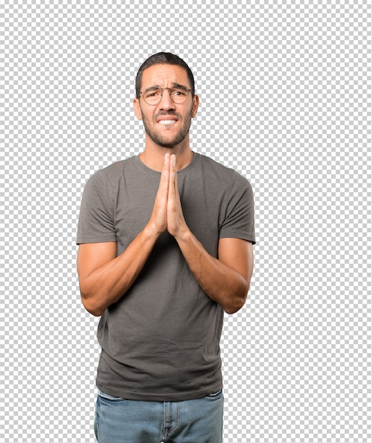 Concerned young man praying gesture