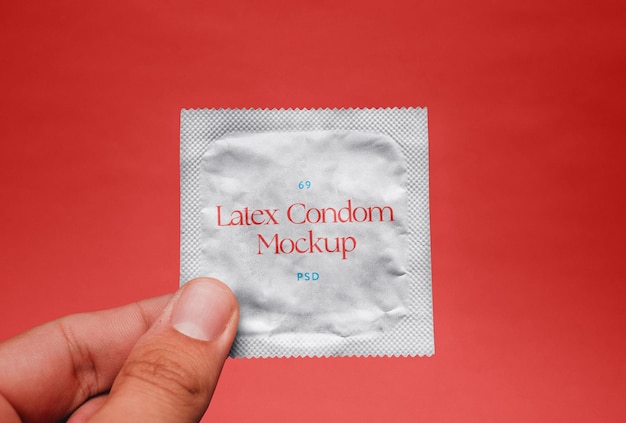 PSD condom in hand mockup