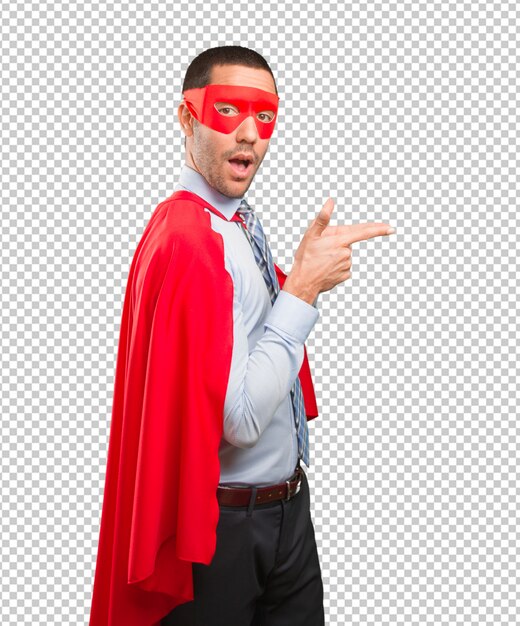 Confident super businessman pointing