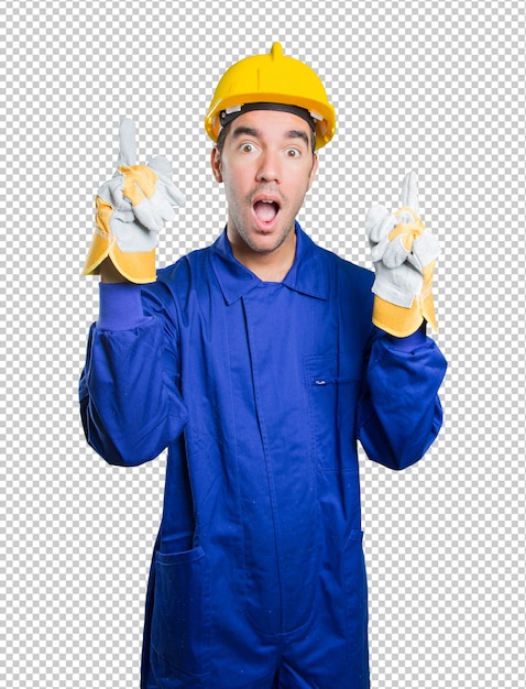 Confident workman pointing up on white background