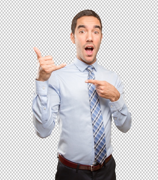 Confident young businessman doing a call gesture