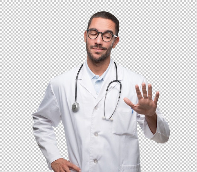 Confident young doctor doing a keep calm gesture