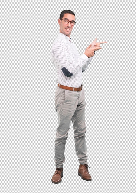 Confident young man pointing with his hand - full body shot