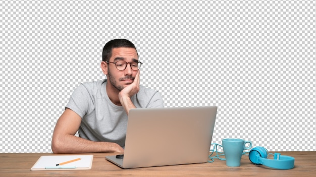 PSD confident young man with a gesture of doubt sitting at his desk