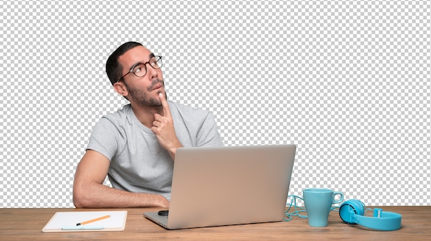 PSD confident young man with a gesture of doubt sitting at his desk