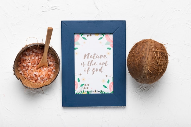 Consciousness quote in frame next to coconut