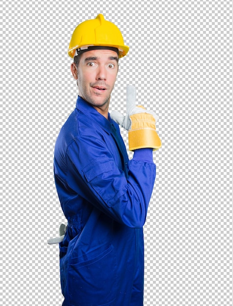 Cool workman pointing on white background