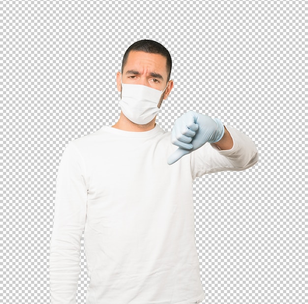 Coronavirus. Jonge man concepten doen en masker en beschermende handschoenen dragen