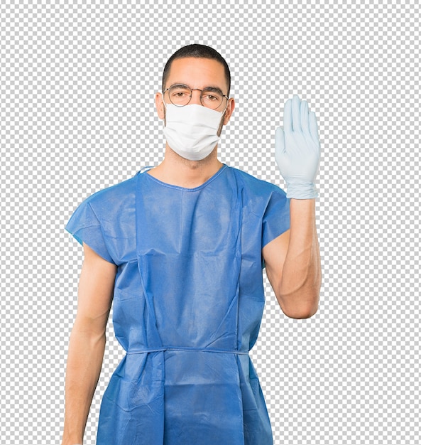 Coronavirus. Jonge man concepten doen en masker en beschermende handschoenen dragen