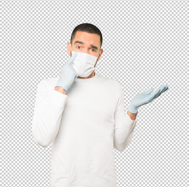Coronavirus. Jonge man concepten doen en masker en beschermende handschoenen dragen