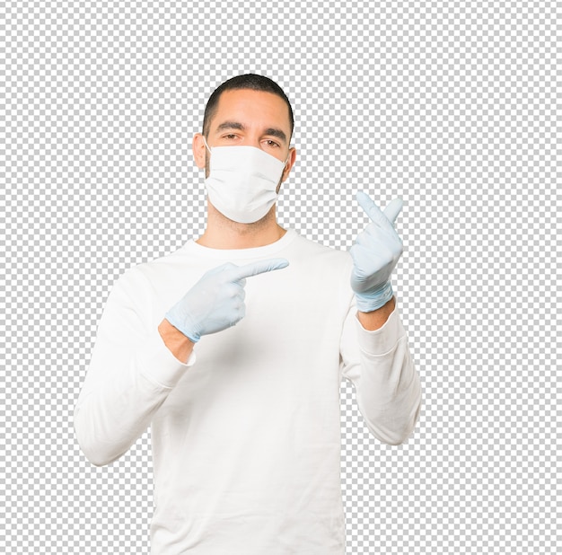 Coronavirus. Jonge man concepten doen en masker en beschermende handschoenen dragen