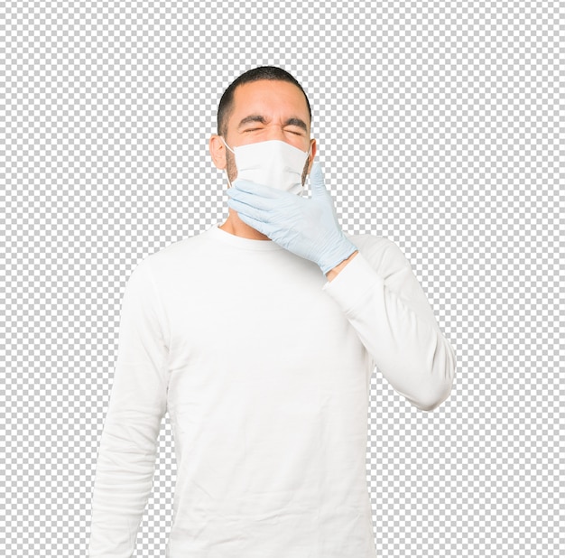 コロナウイルスの概念をやって、マスクと保護手袋を着用して若い男