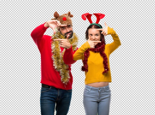 PSD couple dressed up for the christmas holidays focusing face. framing symbol