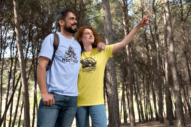 PSD couple outdoors in nature wearing t-shirts mock-up