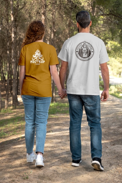 PSD couple outdoors in nature wearing t-shirts mock-up