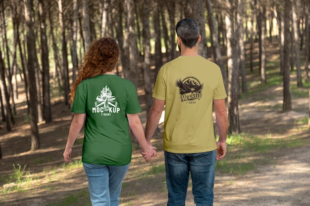 Couple outdoors in nature wearing t-shirts mock-up