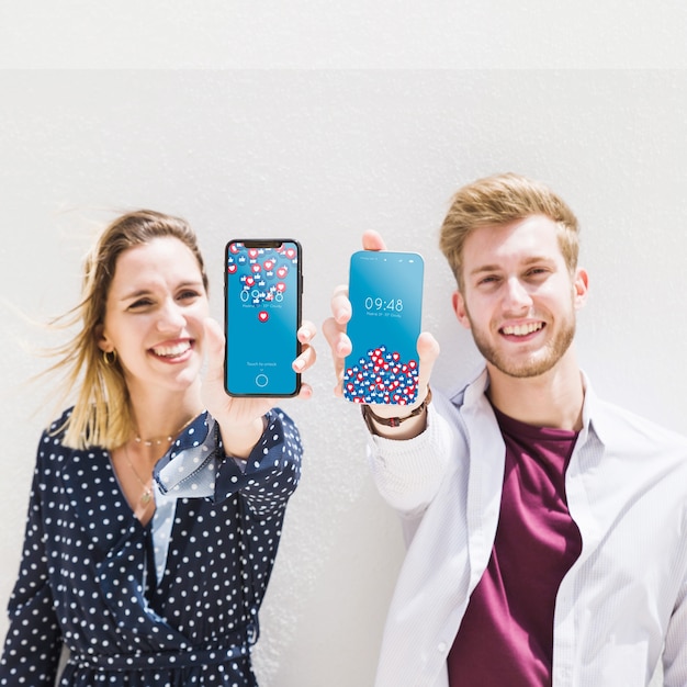 Couple showing smartphone