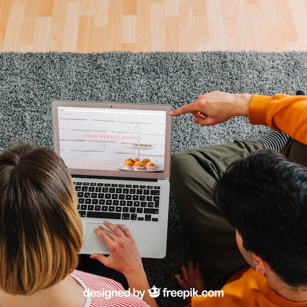 Couple using laptop together