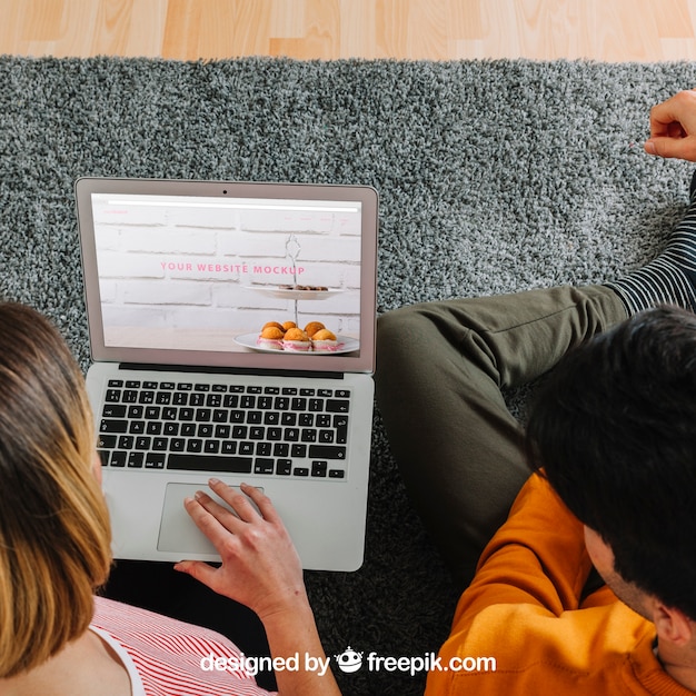 Couple using laptop