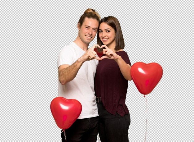 Couple in valentine day making a heart with hands