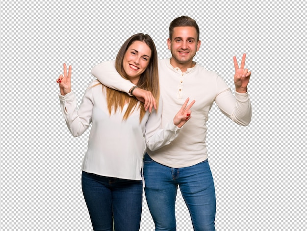 Couple in valentine day smiling and showing victory sign