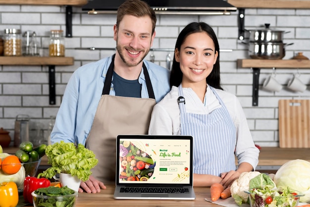 Couple with healthy food in the kitchen mock-up