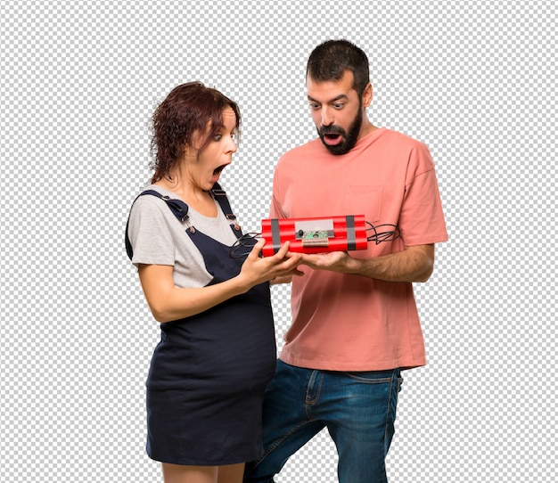 Couple with pregnant woman holding a bomb