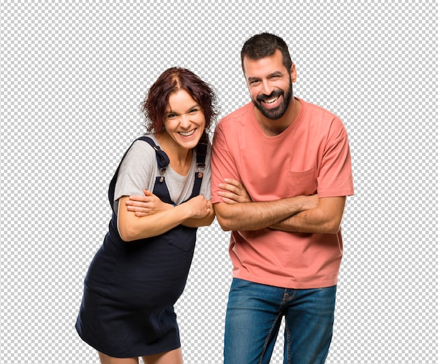Couple with pregnant woman keeping the arms crossed while smiling