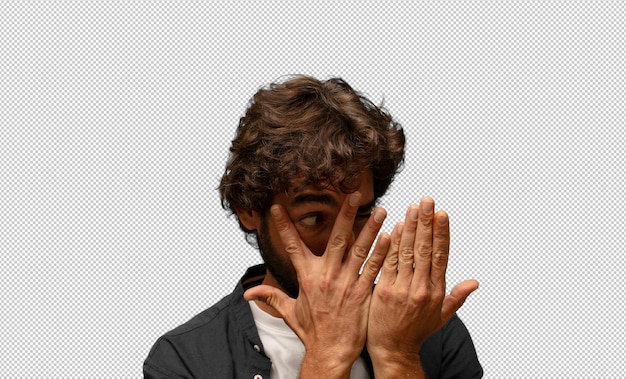 covering face with hands peeking between fingers with surprised expression and looking to the side